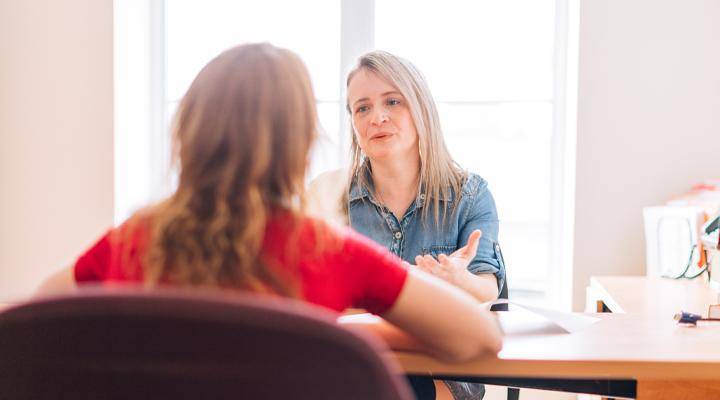 A school guidance counselor with a student