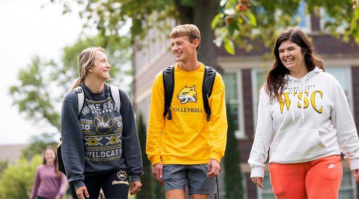Three students walk together on WSC's campus