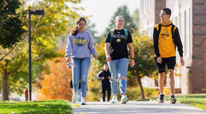 Three students walk together on the WSC campus