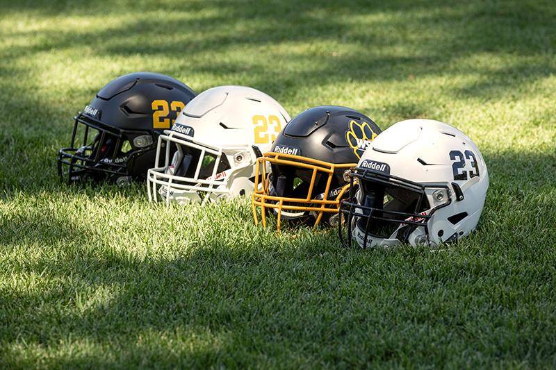 Football helmets on the golf course