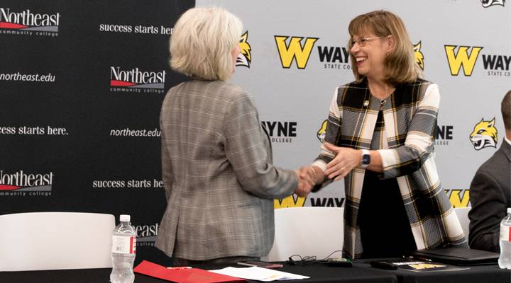 WSC and NECC presidents shake hands