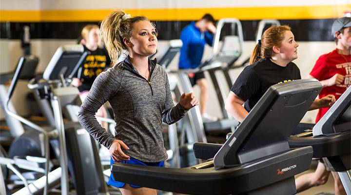 Photo of students running on treadmills in the WSC Rec Center