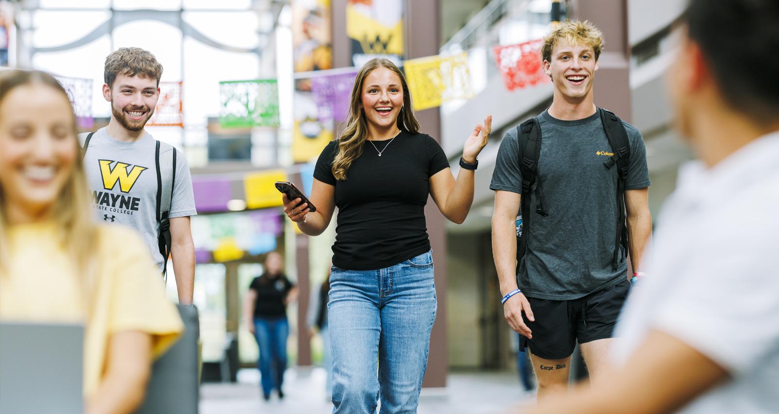 Students join their friends in the Student Center atrium