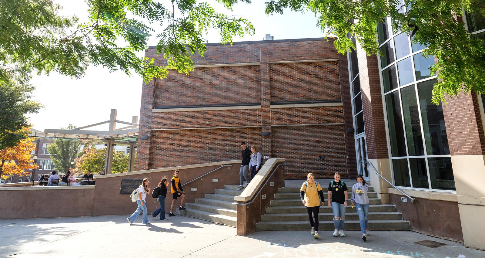 students walk out of the library