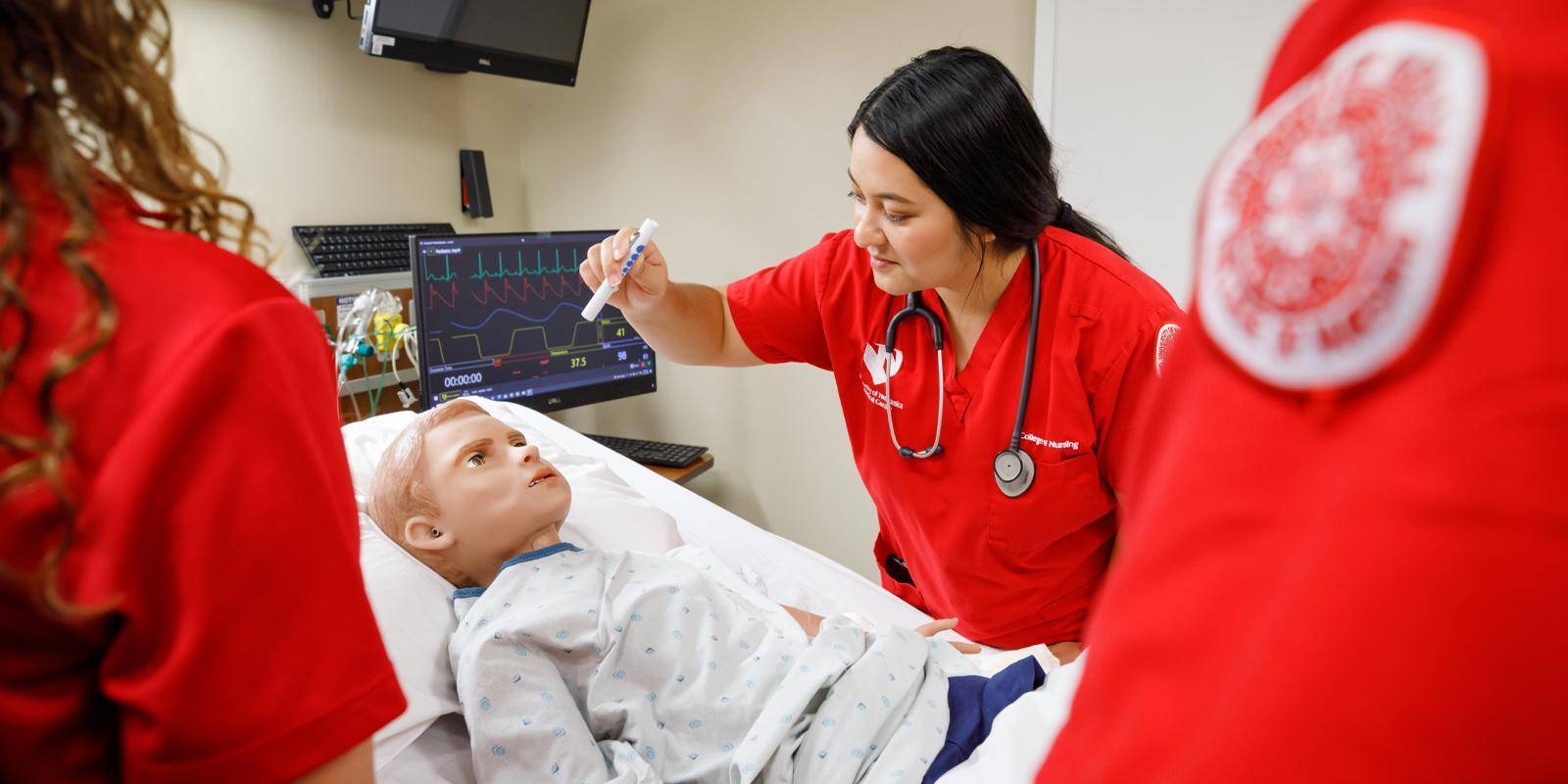 Nursing students at UNMC practice on a patient simulator
