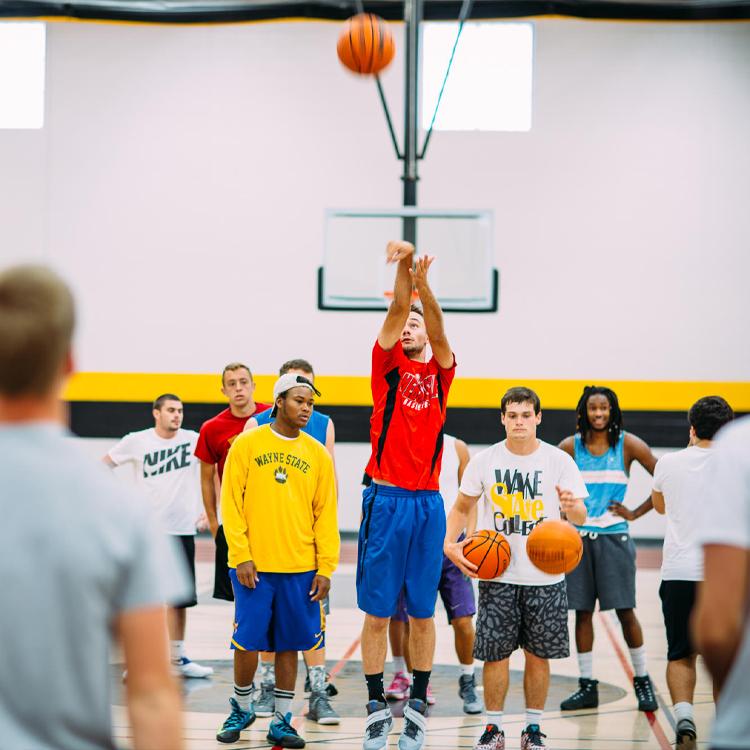Students play basketball in the Rec Center