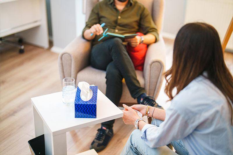 A counselor talks with a client