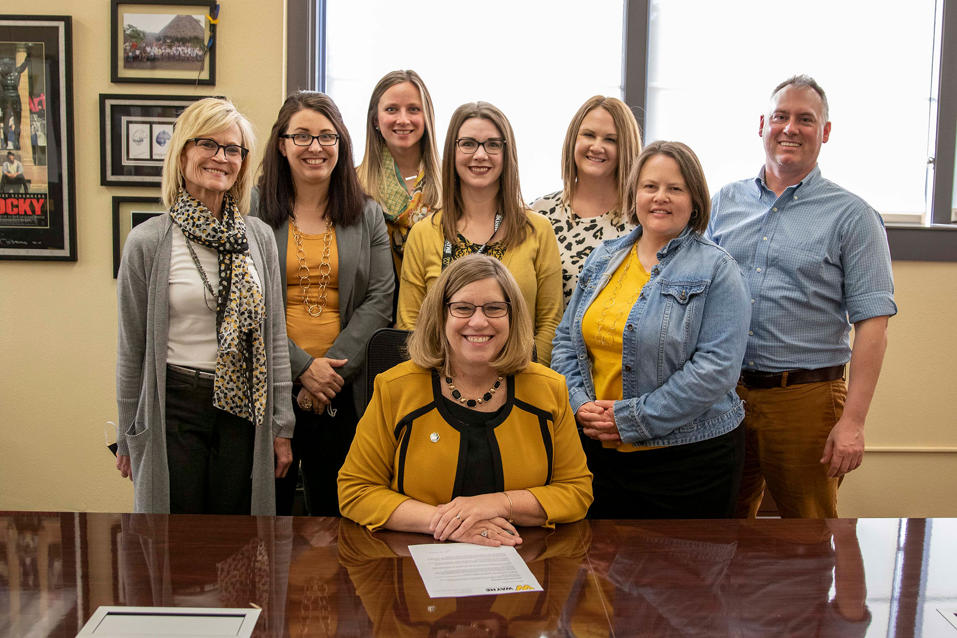 Dr. Marysz Rames signs a first-generation proclamation.