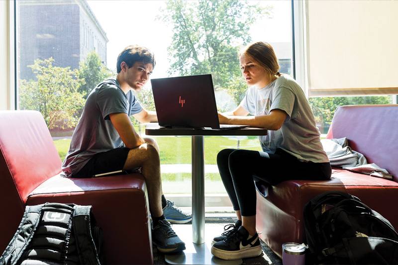 WSC students converse in the library