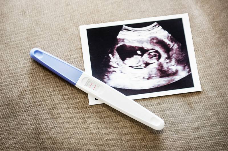 A positive pregnancy test with a sonogram