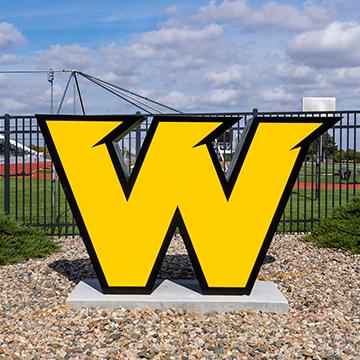 W logo structure by the football field