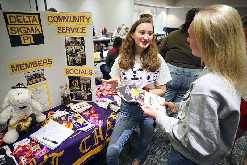 Photo of students talking at the clubs fair