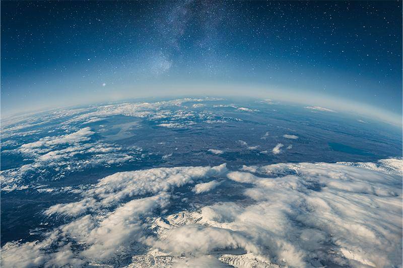 A photo of Earth from space, featuring clouds and oceans