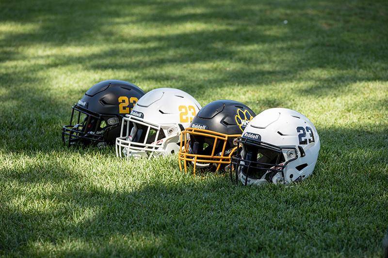 Football helmets on the golf course