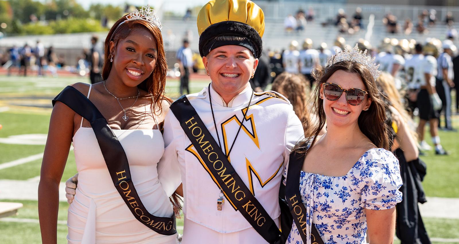 WSC's 2025 Homecoming queen and king pose for a photo on the football field