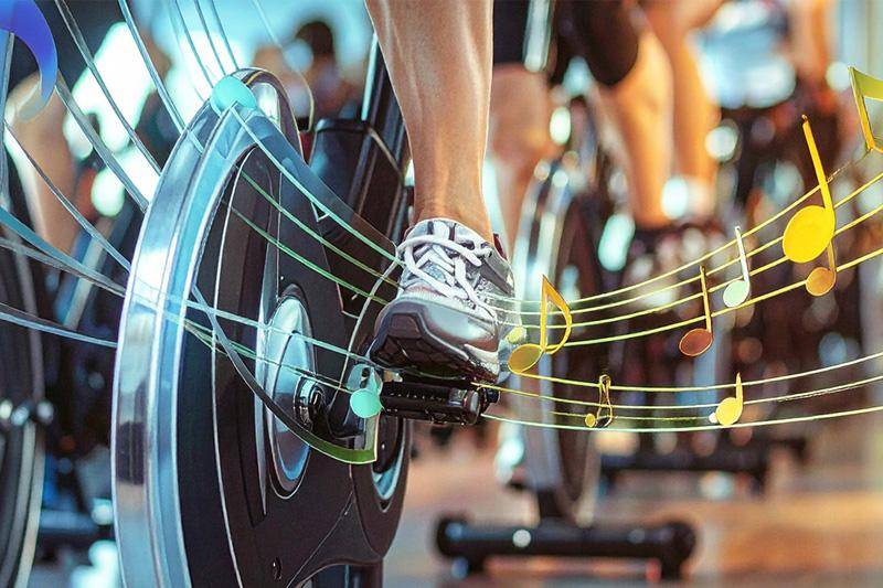 A rhythm and ride featuring a picture of spin bikes with musical notes