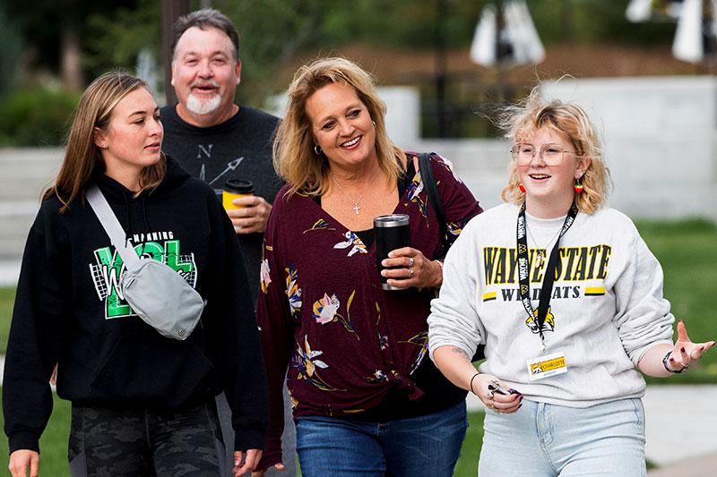 A WSC student gives a campus tour to a group of people