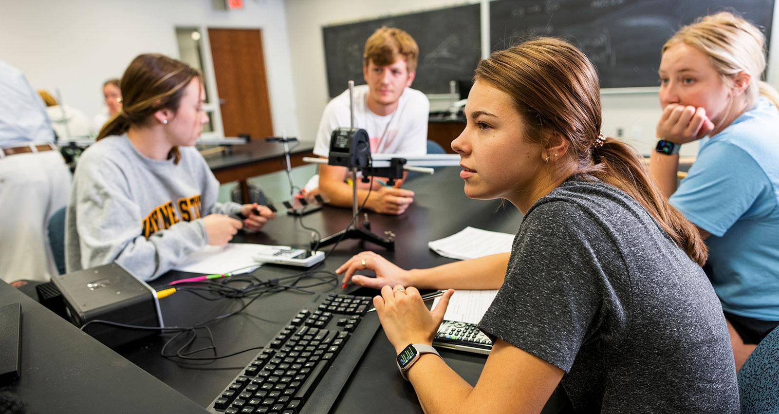 Students work in a physics lab