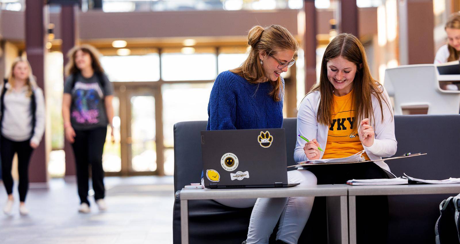 Two WSC students at a laptop in the Student Center