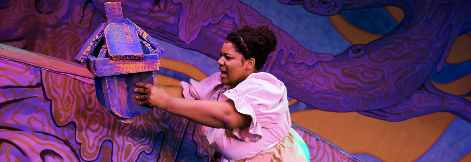 A WSC student performs on stage in "The Squirrels"