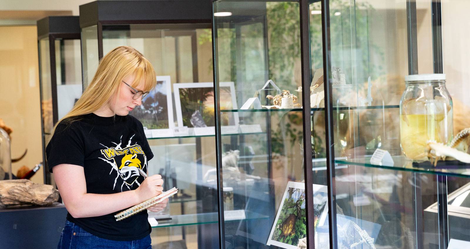 A WSC student explores exhibits in the Natural History Museum