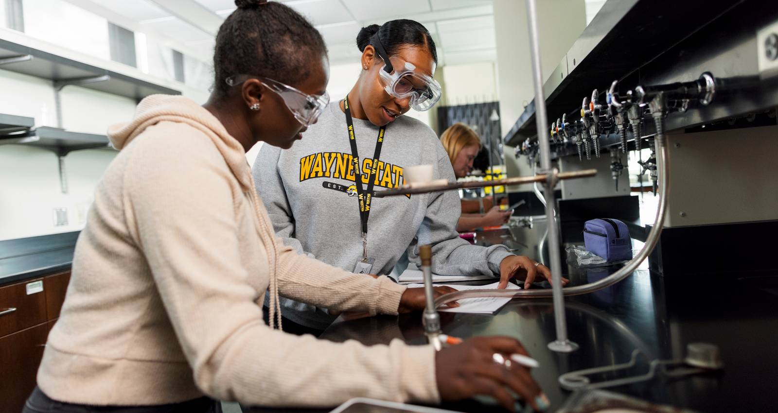 Two students work in a science lab at WSC