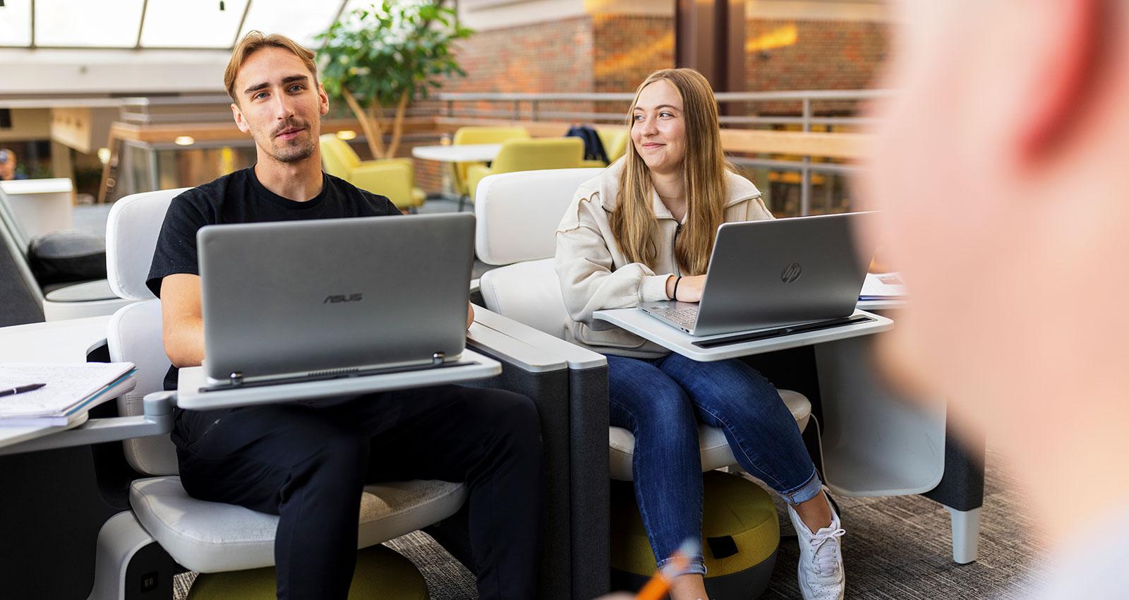 Students work on laptops