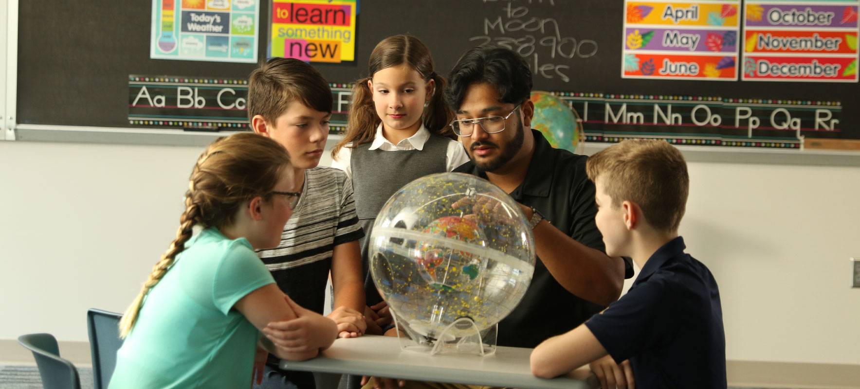 An education major works with students in a classroom