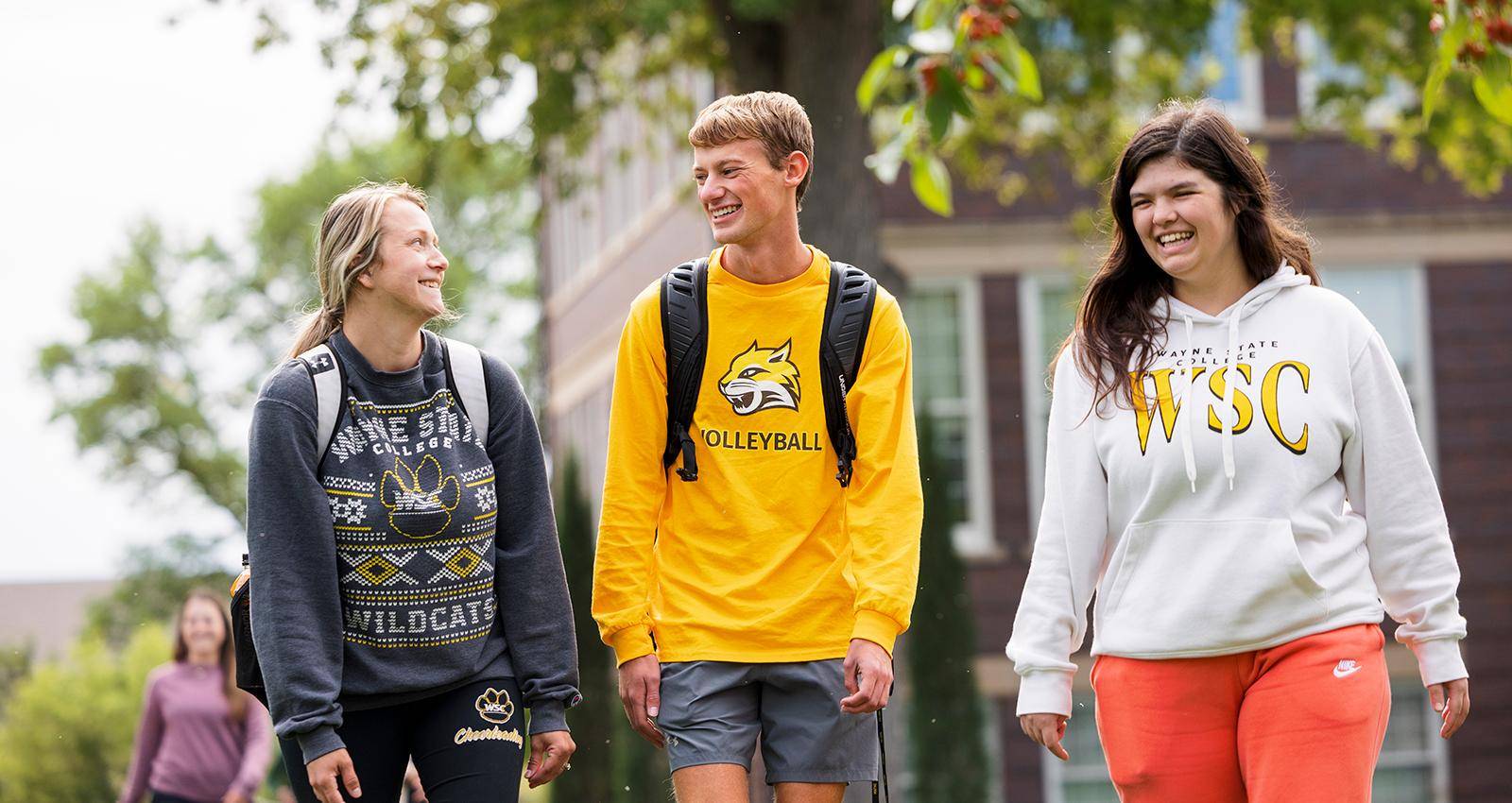 Three students walk together on the WSC campus