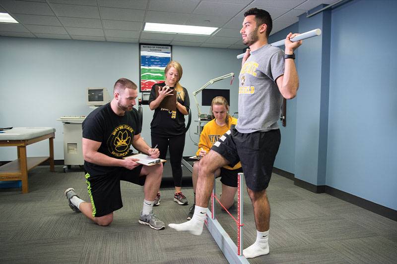 Sport physiology degree students work in the human performance lab at WSC