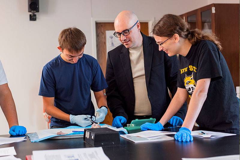 Biology education degree concept featuring students working with a professor in the zoology lab at WSC