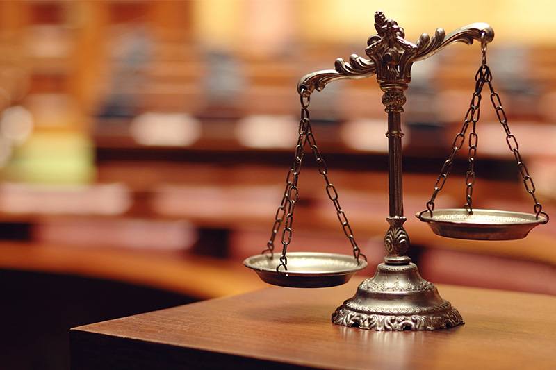 Criminal justice degree concept featuring the scales of justice