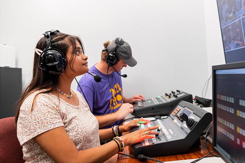 Electronic media degree students work in a television production lab at WSC