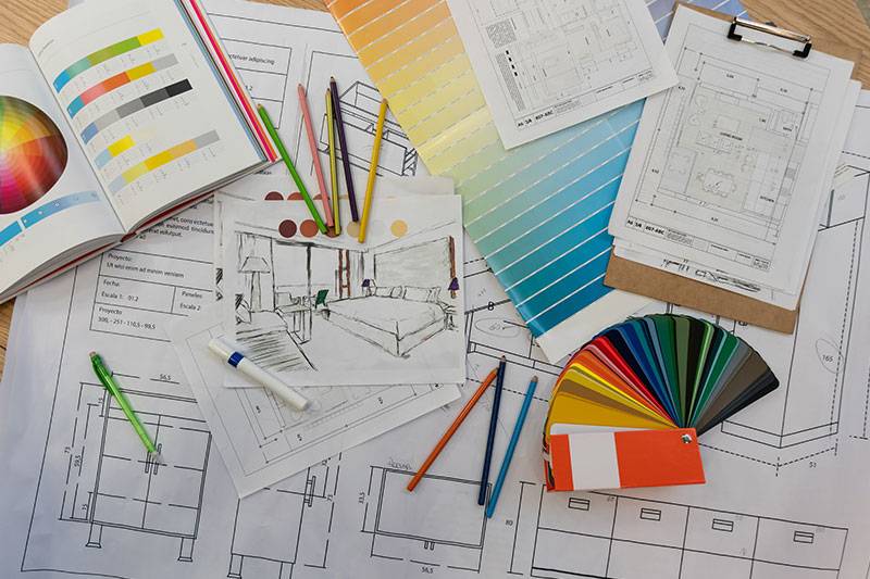 Interior design degree concept featuring swatches and room design plans