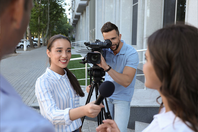 Journalism degree concept featuring a news reporter
