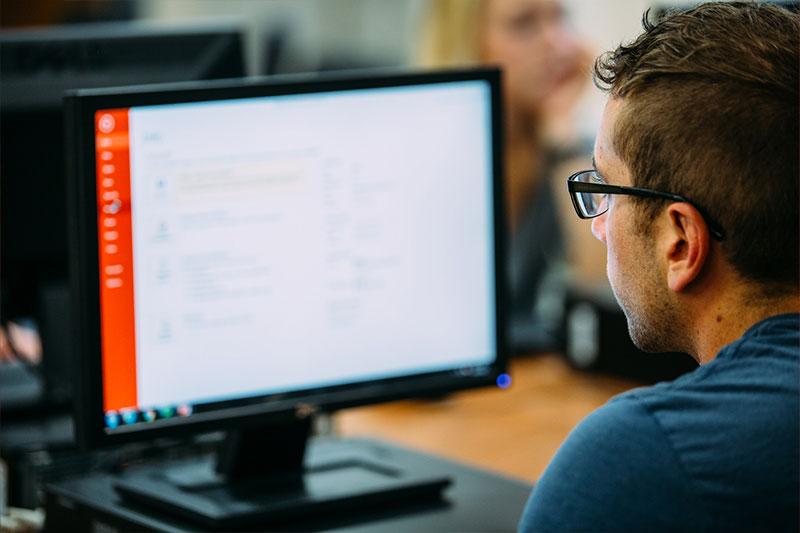 A students works on a computer