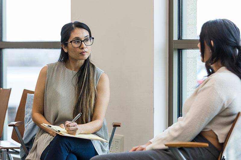A counselor talks to a client