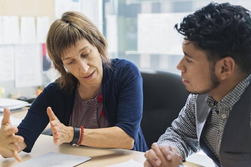 A higher ed professional advises a student