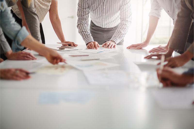 A group of people working together at a table