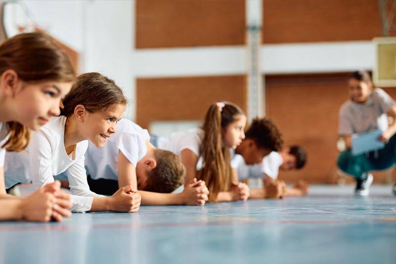 Physical education degree concept featuring a P.E. teacher