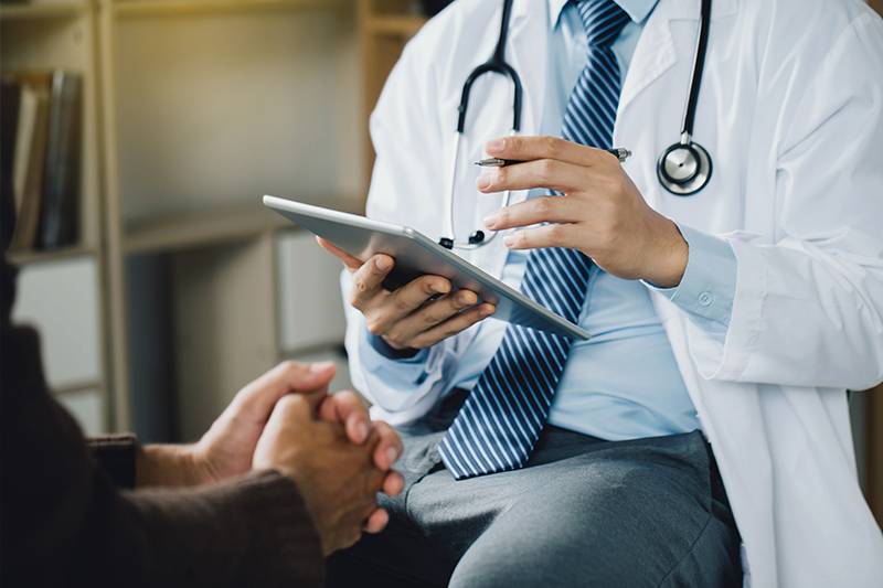 Pre-med degree concept featuring a doctor and a patient