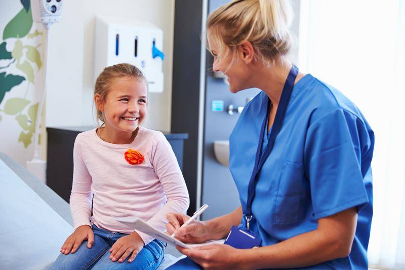 Pre-nursing concept featuring a nurse with a child
