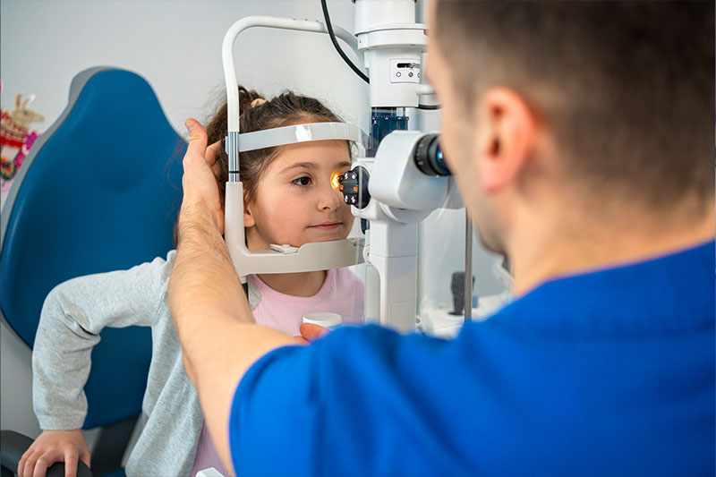 Optometry degree concept featuring an optometrist with a patient