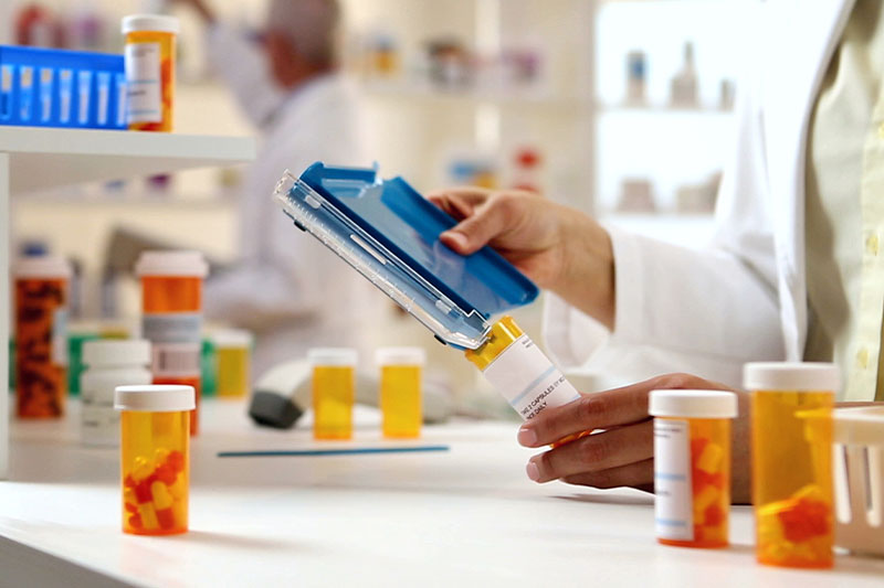 Pre pharmacy degree concept featuring a pharmacist filling prescriptions