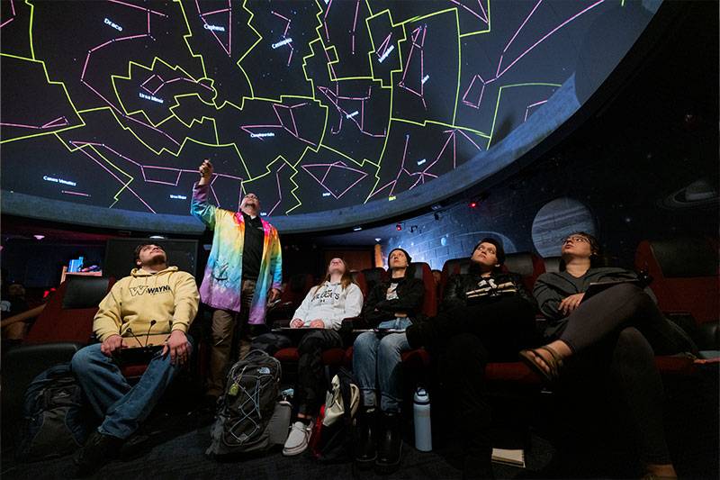 Students in the science education degree program receive an astronomy lesson from a professor at the WSC planetarium