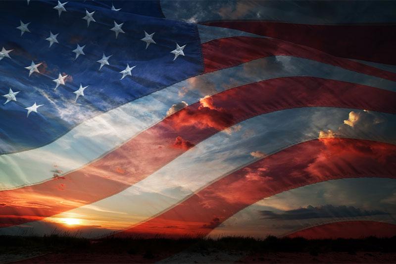 American flag over sunrise