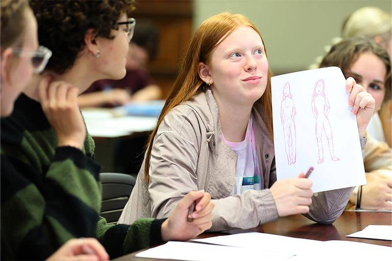 Photo of a student showing a sketch at Drama Day