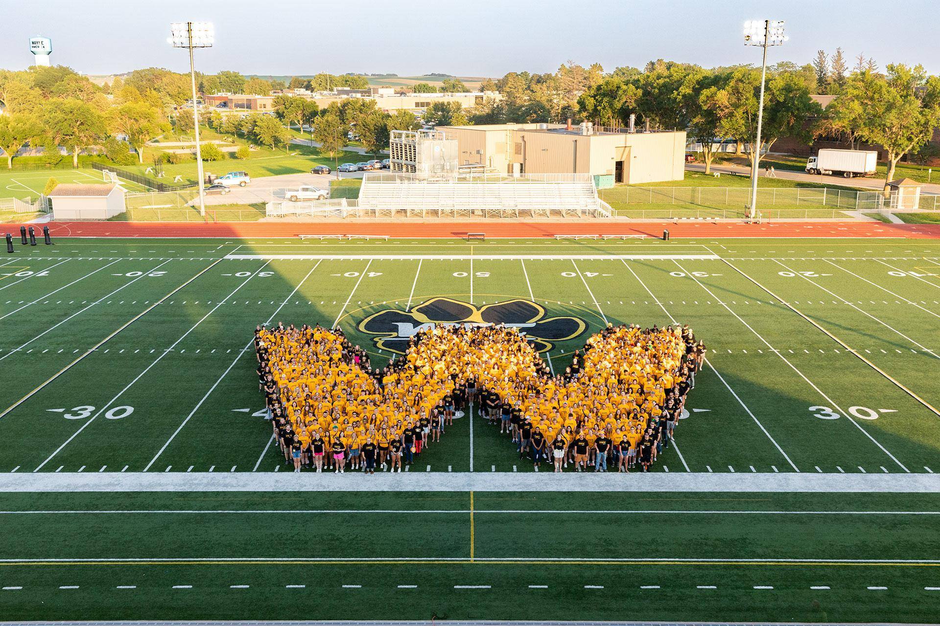 Photo of students in the shape of a W
