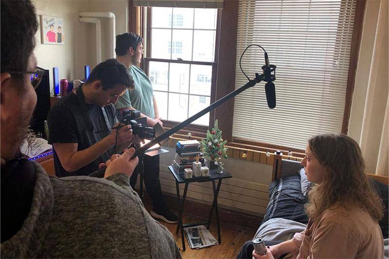 Photo of students recording film and audio