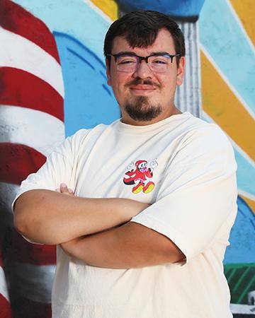 Portrait of Gabe Perez, the artist who created the downtown Wayne mural